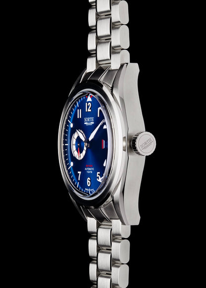 Silver stainless steel watch with a blue dial, white numerals and red colour accents. Includes a seconds hand dial and date display. Watch it shown from the side.